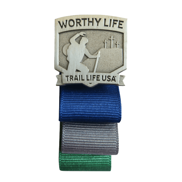 Trail Life USA Worthy Life Award badge for boys, featuring hiker and crosses