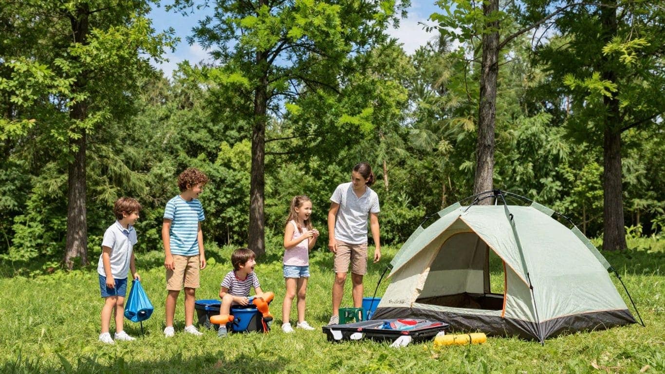 Children and adults enjoying camping at a forested site near Alpharetta, GA.