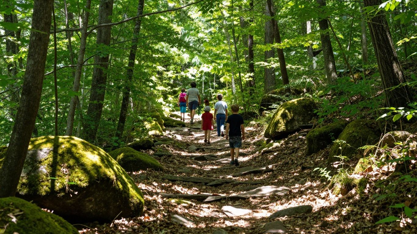 Family hiking on forest trail at Chattahoochee Nature Center, Georgia.