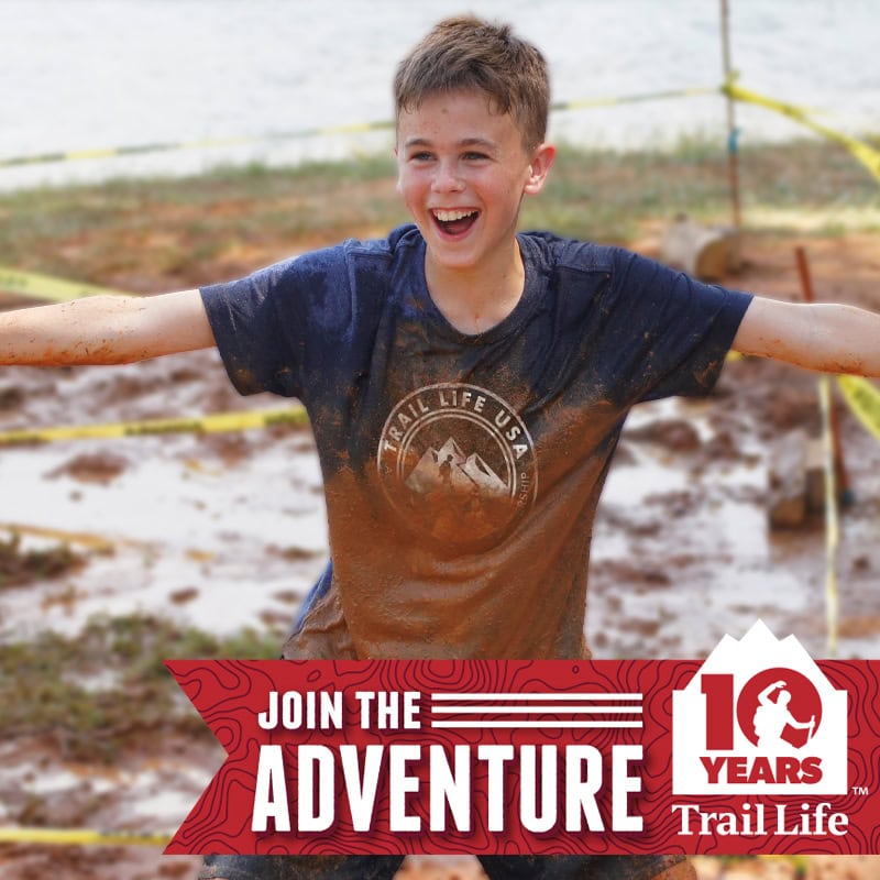 Boy smiling and playing outdoors at Trail Life GA-4100 event in Alpharetta.